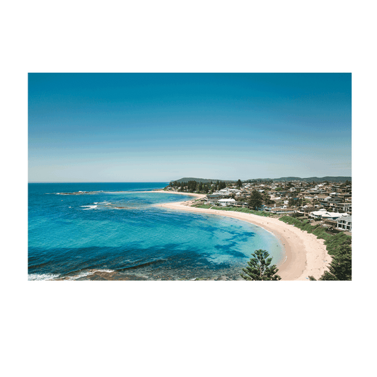 Aerial view of Blue Bay, NSW, showcasing vibrant turquoise waters, golden sands, and a stunning coastal landscape.