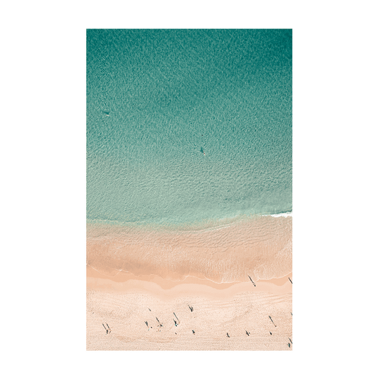 A tranquil aerial view of Bondi Beach, Sydney, showcasing golden sands, gentle waves, and beachgoers casting long shadows.
