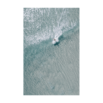 A lone surfer carves through the crystal-clear waters of Crescent Head, NSW, captured in a stunning aerial coastal print.