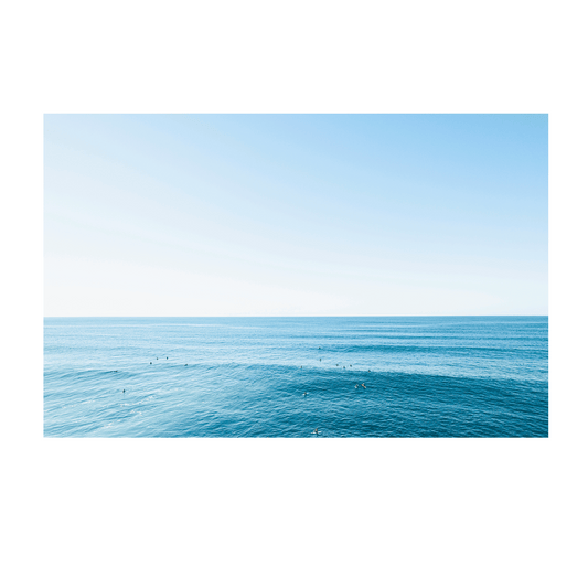 A breathtaking coastal aerial print of Forresters Beach, NSW, showcasing rolling waves, surfers, and the deep blue hues of the ocean.
