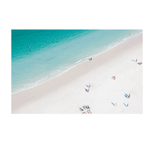 Aerial print of Hyams Beach on the South Coast of NSW, featuring crystal-clear turquoise waters meeting the softest white sand. A tranquil coastal scene with beachgoers basking in the sun, perfect for modern coastal wall art.