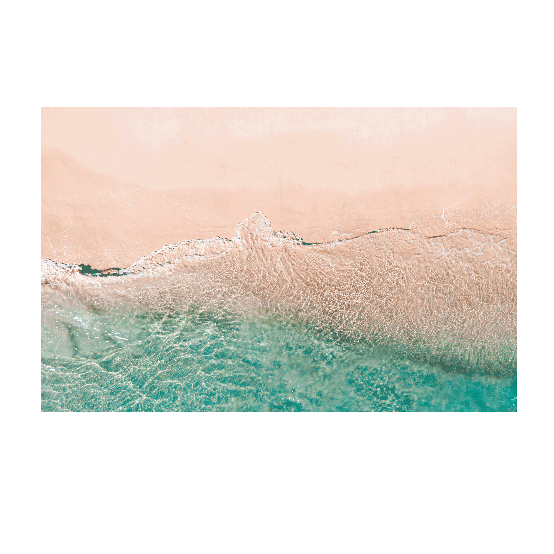 A soft aerial coastal scene at Norah Head, NSW, showcasing the gentle transition between sandy beach and clear aqua ocean waters.
