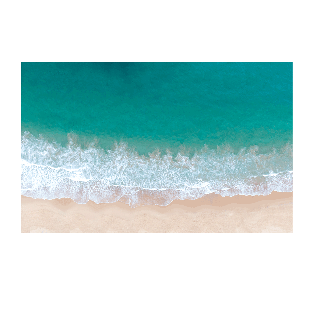 Aerial view of rolling turquoise waves meeting the soft sandy shore at Terrigal Beach, NSW, highlighting the ocean’s natural patterns.