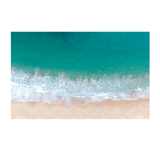 Aerial view of rolling turquoise waves meeting the soft sandy shore at Terrigal Beach, NSW, highlighting the ocean’s natural patterns.