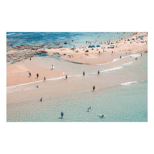 Aerial view of Toowoon Bay Beach on the Central Coast, capturing beachgoers enjoying the shoreline with blue tents scattered across the sand. A vibrant coastal print reflecting the essence of a late summer day.
