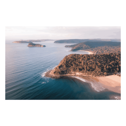 Discover the beauty of Umina Beach with Rolling Umina – a stunning aerial coastal print featuring scenic cliffs, golden sands, and deep blue ocean waters. A perfect piece for ocean lovers.
