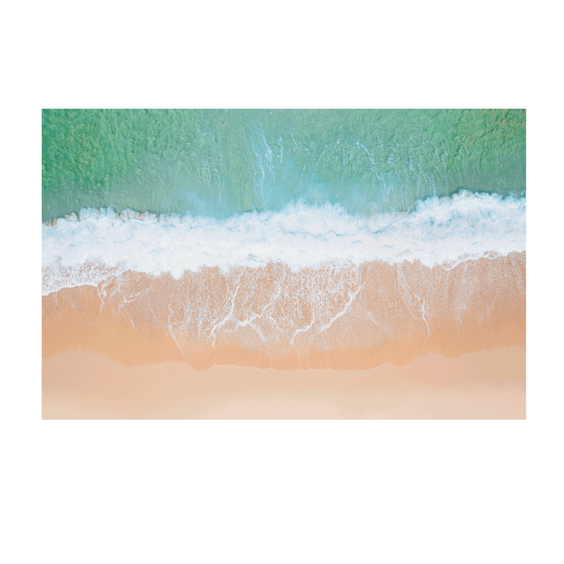 An aerial view of Wamberal Beach, NSW, showcasing waves washing onto golden sand with soft aqua and turquoise ocean tones.
